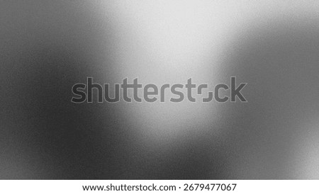 Abstract gradient in grayscale showcases a grainy, textured surface. The monochrome design creates a modern, grunge aesthetic, perfect for backgrounds.