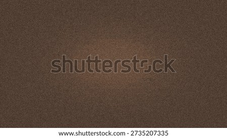 Abstract grainy brown texture background with warm spotlight