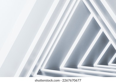 Abstract illuminated white triangular interior. Design concept. 3D Rendering