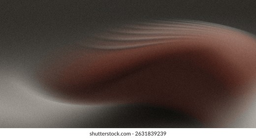 An abstract image featuring a blurred blend of brown and gray tones. The colors swirl and blend together creating a smooth, indistinct form.