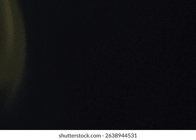 An abstract image featuring a blurred effect, dominated by a dark background with subtle light streaks on the left side. The overall impression is one of soft, indistinct shapes and muted colors.