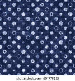 Abstract indigo dyed effect variegated polka dot textured background. Seamless pattern.