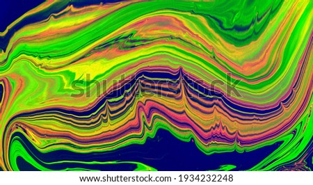 Abstract multi-colored marble background. Acrylic paint flows freely and creates an interesting pattern. Background for web design, notepad cover.