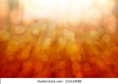 Abstract Orange Bokeh Background With Lens Flare