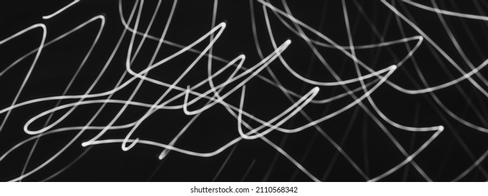 Abstract Painting With White Light On Black. Waves And Curved Lines. Creativity. Photo Effect.