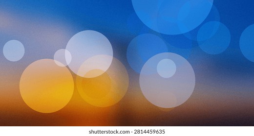 Abstract pattern with colorful bokeh lights. Blurry circles in various sizes over dark blue and orange backdrop. Digital art with grain and grunge effect.