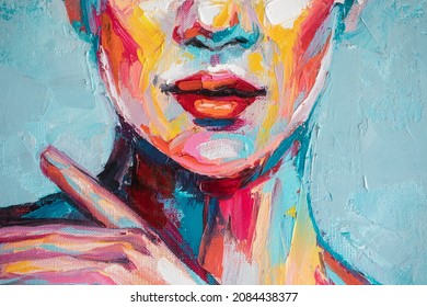 Abstract picture of a beautiful woman. Fragment Oil portrait painting in multicolored tones.Conceptual closeup of an oil painting and palette knife on canvas.