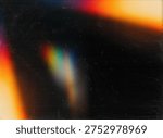 Abstract rainbow light leak effect on dark grainy film texture