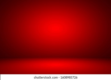 Abstract red gradient spotlight room texture background. 
Studio backdrop wallpaper light room wall color red and empty space.
