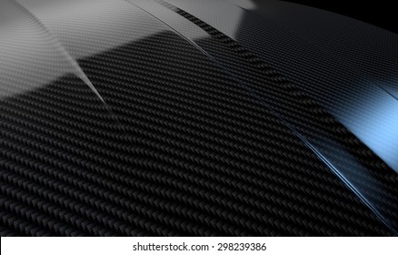 An abstract section of the contours of a carbon fiber automobile bonnet with dramatic lighting on a dark studio background