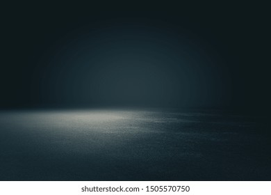 Abstract spacious place with dark wall, granular floor and spot light from above. 3D Rendering
