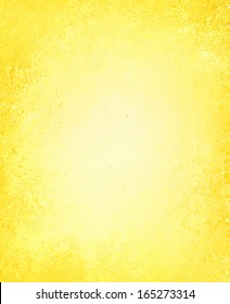 abstract yellow background color, aged vintage grunge background texture, rough distressed paint surface, soft faded white center and bright sunny yellow border for spring or Easter background