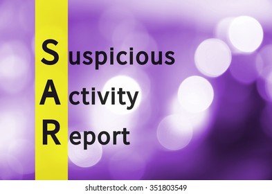 Acronym SAR As Suspicious Activity Report. Background With Defocused Lights.