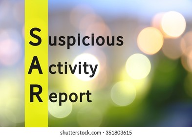 Acronym SAR As Suspicious Activity Report. Background With Defocused Lights.