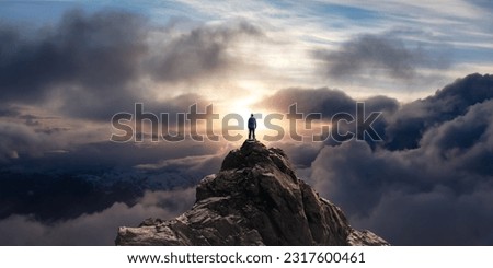 Adventurous Man Standing on top of Mountain Cliff. Extreme Adventure Composite. 3d Rendering Peak. Background Aerial Image from British Columbia, Canada. ストックフォト © 