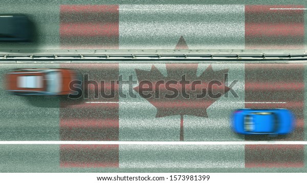 Aerial top down view of\
cars and flag of Canada on the road. Traveling related conceptual\
3D rendering