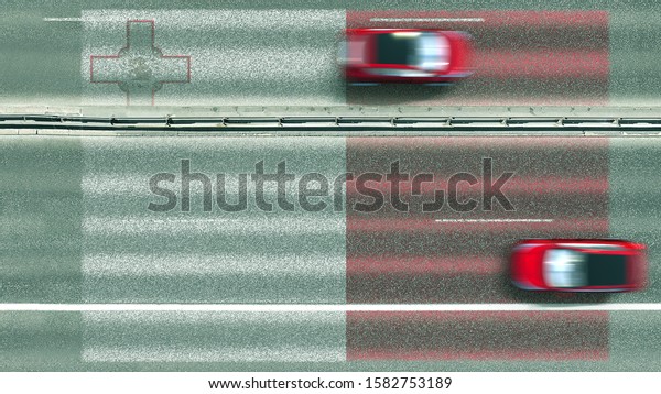 Aerial top down\
view of cars revealing flag of Malta on the road. Traveling related\
conceptual 3D\
rendering