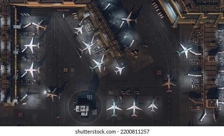 Aerial View Of A Commercial Airport 3D Render With Airplanes, Passenger Terminals, Runway And Service Machinery. Top Down View Of Modern VFX Aircrafts Moving In International Port In The Evening.