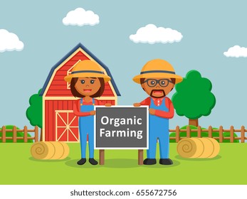 african farmer man and african farmer woman holding organic farming sign board - Powered by Shutterstock