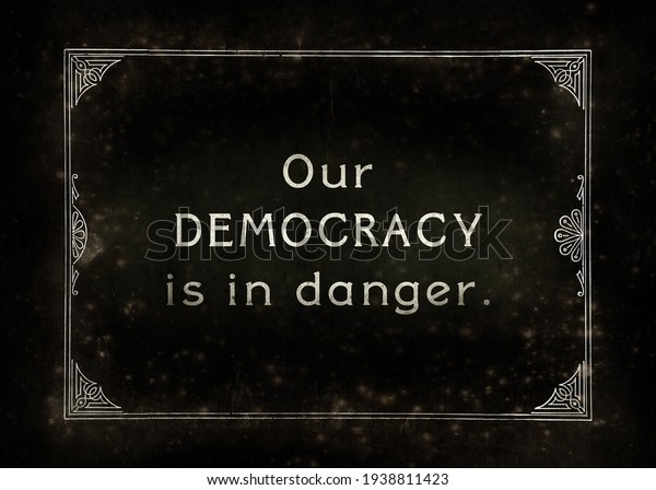 An\
aged film frame, from the silent era (intentional noise and dust\
effects), with the text Our democracy is in\
danger.\
