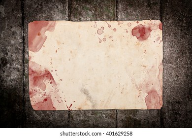 Aged paper sheet with blood stains
