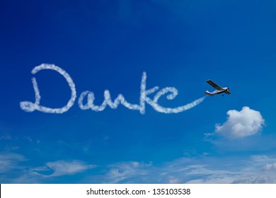 Airplane Painting The German Word Danke (Thanks) In The Sky