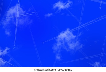 Airplane Trails On Blue Sky