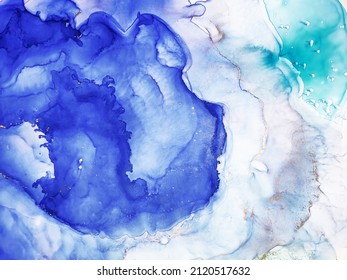 Alcohol Abstract. Water Aquamarine Pigment Watercolor drawn. Ink splash. Sky color, White and Gold Streaks. Blue ice Spray. Alcohol Ink Drops. Background for Cards.