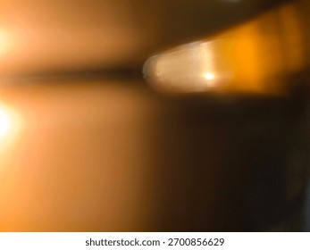 Alcohol light effect background, orange, yellow, like a sparkling diamond, heat and beer steam melts and evaporates finally.
