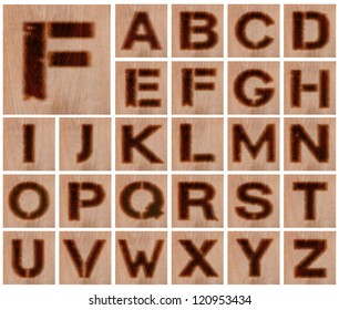 Alphabet - Collection Of Letters Burnt In Wood - Isolated On White