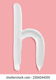 Alphabet Letter H Handwritten, White Cream Moisturiser Texture Smear Stroke Isolated On Pink Background
