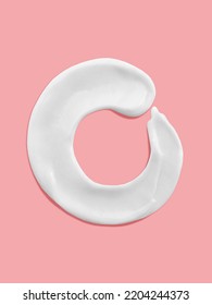 Alphabet Letter O Handwritten, White Cream Moisturiser Texture Smear Stroke Isolated On Pink Background
