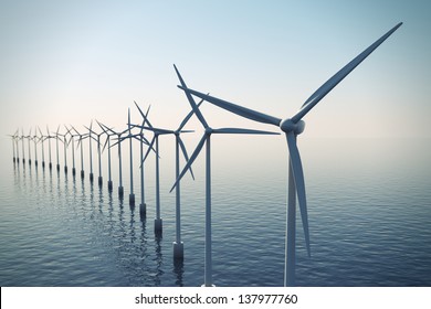Alternative energy- shot of row of floating wind turbines during foggy morning.