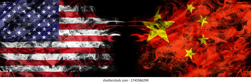 American and Chinese flags in smoke shape on black background. Concept of conflict war and customs duty. America VS China metaphor. Dollar Yuan exchange currency and international commercial tension.