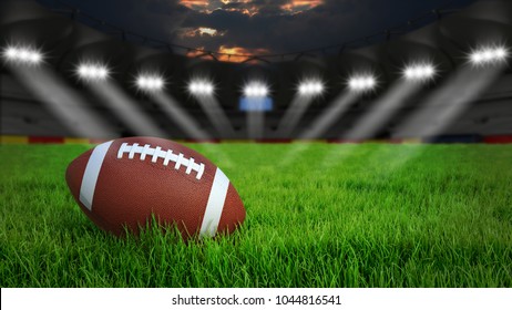 American football arena with ball on green grass illumination at night, 3D rendering - Powered by Shutterstock