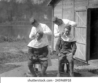 American Soldiers Get Hair Cuts At The 166th Field Hospital, Baccarat, France. WWI. May 15, 1918.