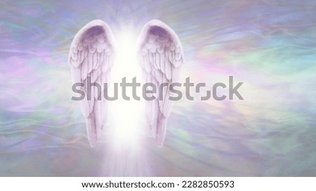 Angelic Light Being Message Template - Pair of lilac Angel Wings with bright white light between against a flowing ethereal gaseous pastel coloured energy formation background with copy space 
