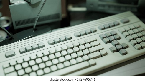 Angled keyboard with worn keycaps capturing tactile texture, numeric keypad in focus, soft shadowing, office relic repurposed for study and data entry