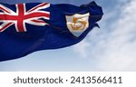 Anguilla Flag waving in the wind on a clear day. Blue Ensign with British flag in canton, coat of arms, three dolphins on white shield. 3d illustration render. Fluttering fabric