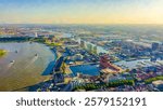 Antwerp, Belgium. Watercolor illustration. Flying over the roofs of the historic city. Schelde (Esco) river. Industrial area of the city, Aerial View