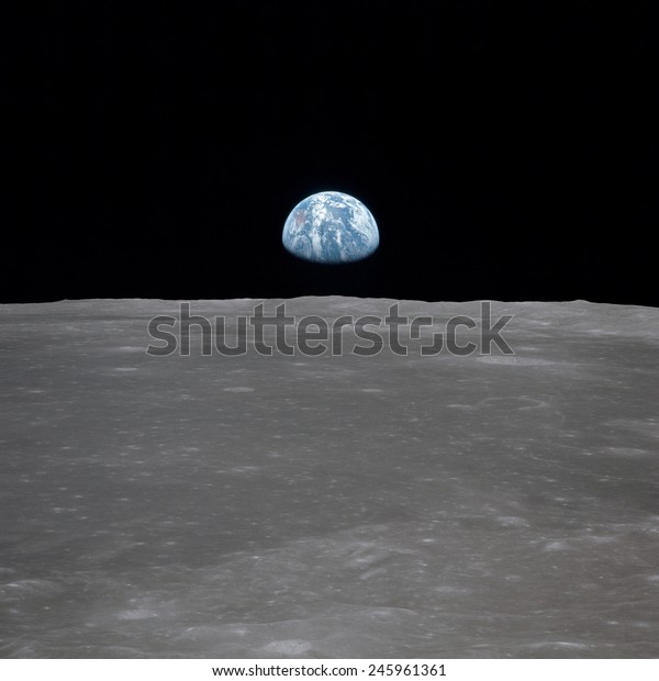Apollo 11 Earth rise over the Moon. Earth on\
the horizon in the Mare Smythii Region of the Moon. Image 5 of a\
NASA sequence of 18. July 20,\
1969.