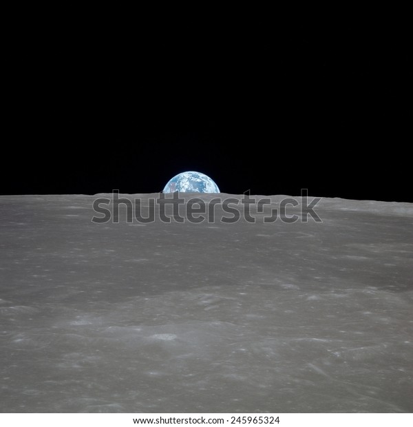 Apollo 11 Earth rise over the Moon. Earth on\
the horizon in the Mare Smythii Region of the Moon. Image 1 of a\
NASA sequence of 18. July 20,\
1969.