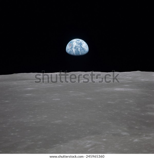 Apollo 11 Earth rise over the Moon. Earth on\
the horizon in the Mare Smythii Region of the Moon. Image 7 of a\
NASA sequence of 18. July 20,\
1969.