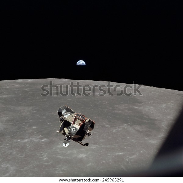 The Apollo 11 Lunar Module ascending from Moon\'s\
surface. In the background is Mare Smythii with the Earth on\
horizon. July 20,\
1969.