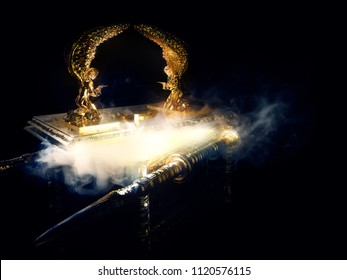ark of the covenant with its lid open and smoke coming out on a dark background / 3D illustration