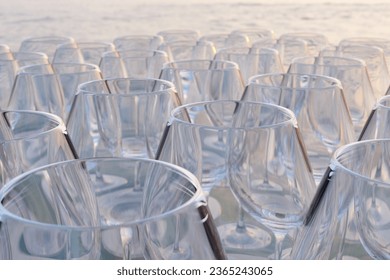 Array of wine glasses on the seashore. 3D illustration of the concept of winery industry, wine business and beverage trading