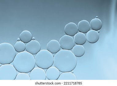 Art Image Of Oil And Water Bubbles Creating Pattern Wall On Pale Blue  Gradient Background.