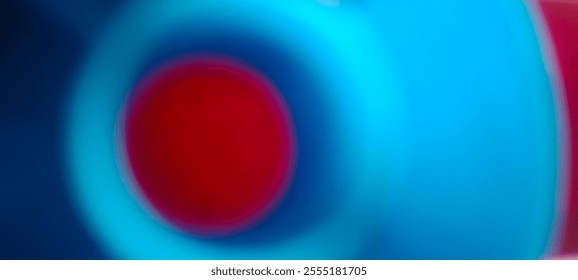 An artistic blur effect image featuring a red circle in the center, surrounded by bright blue gradients, giving an abstract and modern aesthetic impression.