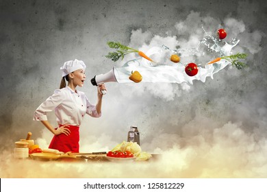 Asian Female Cook Holding Megaphone Vegetables Flying In Air