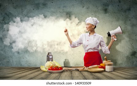 Asian Female Cook Holding Megaphone With Space For Text